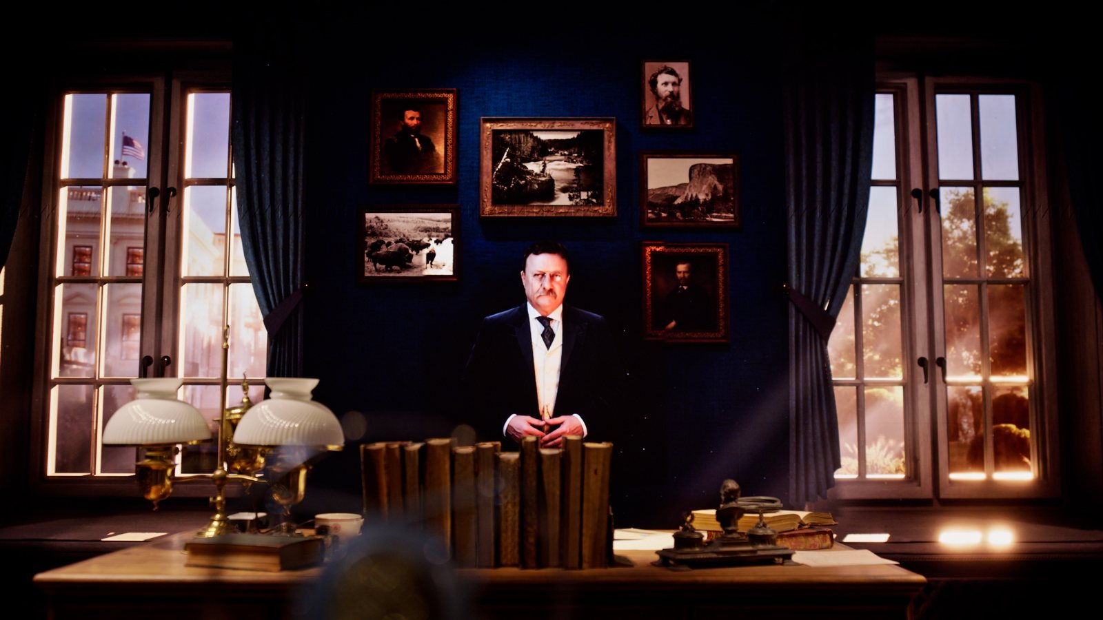 The Talk to TR exhibit — a full-scale digital Theodore Roosevelt standing at his desk in a recreated White House study, with period photographs on the wall behind him