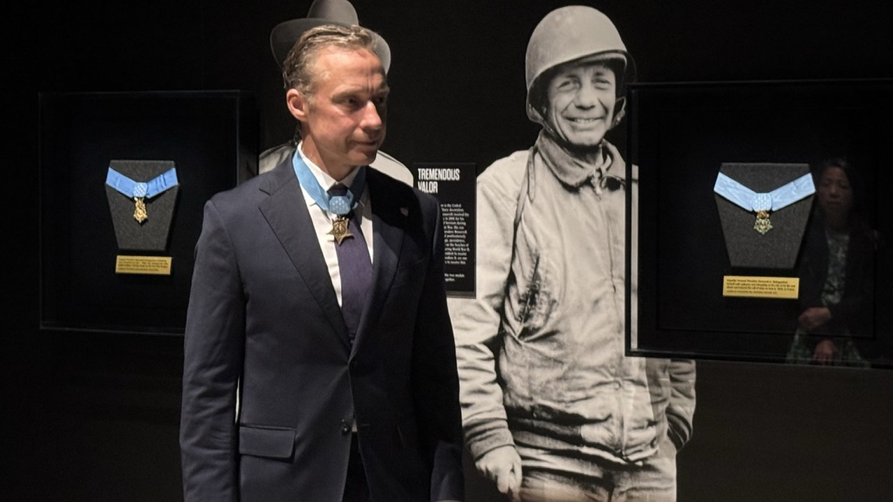 Both Roosevelt Medals of Honor installed in the gallery, with a period photograph of Theodore Roosevelt Jr. in uniform behind