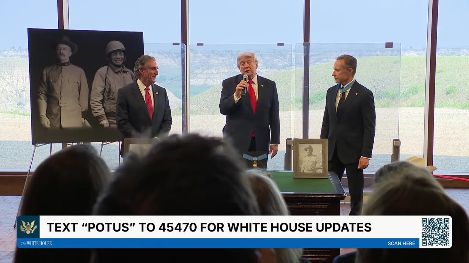 Broadcast frame of the Medal of Honor presentation at the Theodore Roosevelt Presidential Library, with a period photograph of Roosevelt displayed alongside